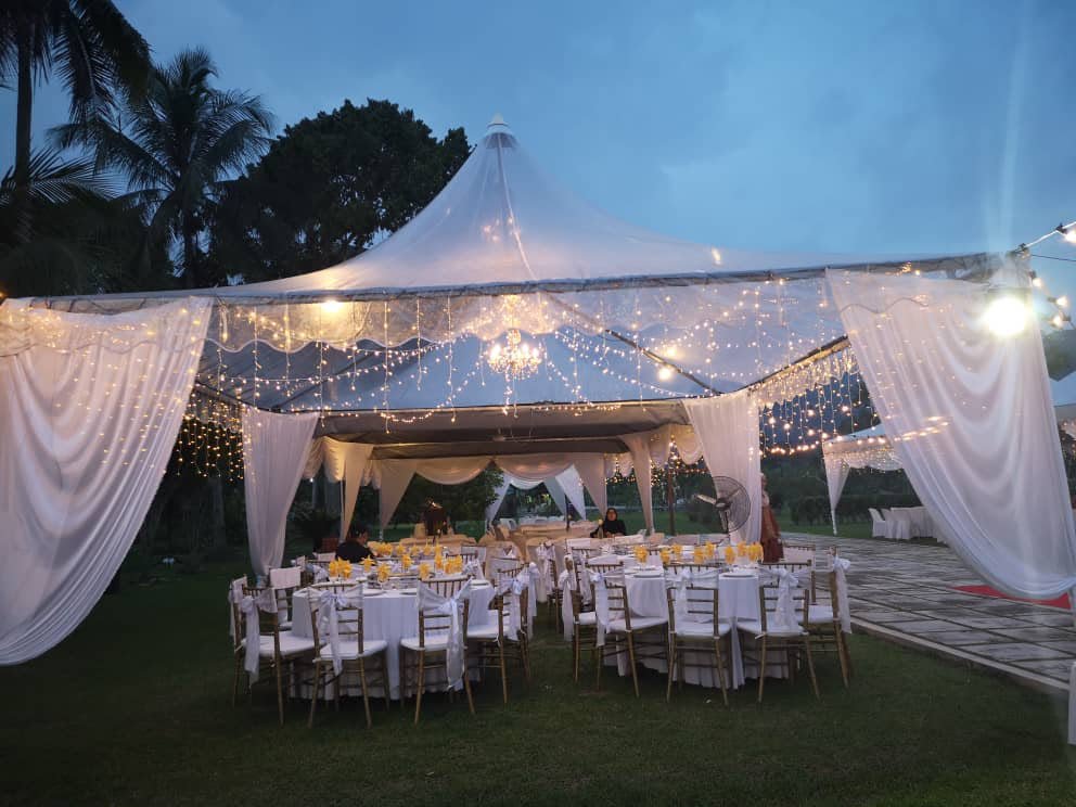 Outdoor event tent and dining setup